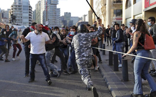 Scuffles break out in Beirut as protesters block lawmakers’ path