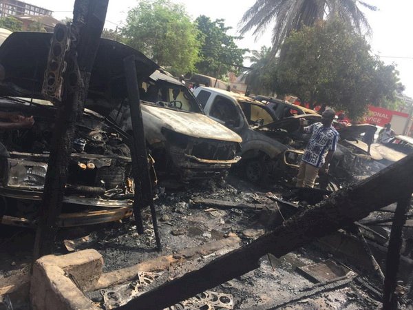 Mechanic shop fire burns five cars, house