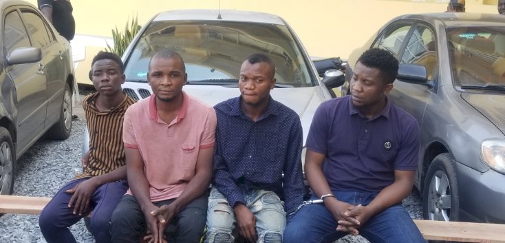 Police parade banker who led accomplices on bank robbery