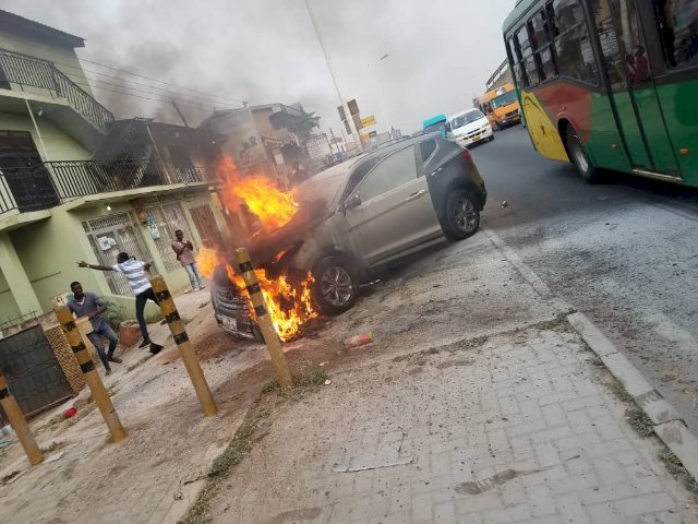 Car catches fire, crashes onto sidewalk at Mile 7