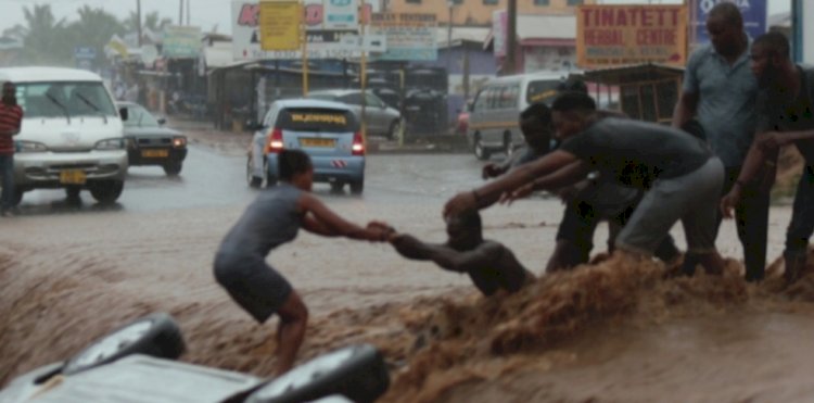 4 rescued after floodwaters carried vehicle into storm drain